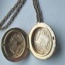 A large medallion featuring religious symbols, suspended from a long chain. Image 8
