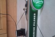 Tall light up Carlsberg beer tap tower