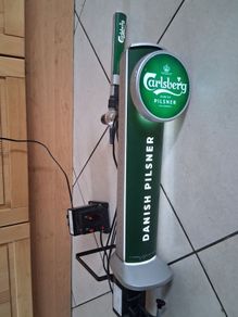 Tall light up Carlsberg beer tap tower