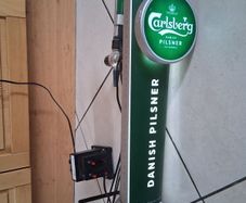 Tall light up Carlsberg beer tap tower