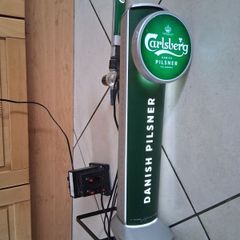Tall light up Carlsberg beer tap tower