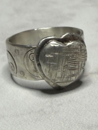 Handmade sterling silver love heart ring with trickles on the wide band. Size R