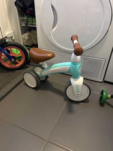 Two toddler bikes and a balance bike