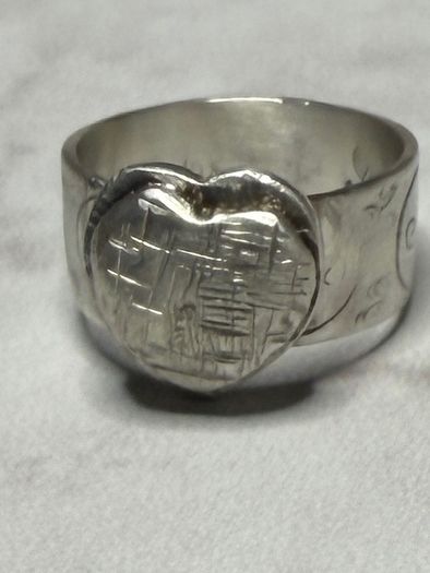 Handmade sterling silver love heart ring with trickles on the wide band. Size R