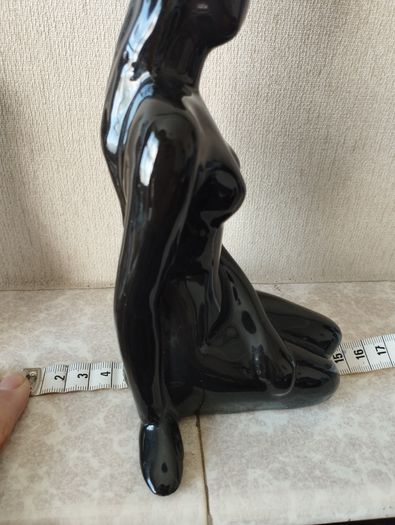 Vintage statue of a seated woman, nude figure, ceramic, glossy black.