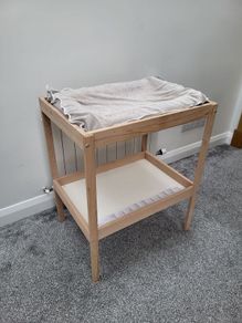Ikea changing table and inflatable mat with removable cover.