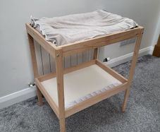 Ikea changing table and inflatable mat with removable cover.