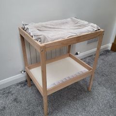 Ikea changing table and inflatable mat with removable cover.