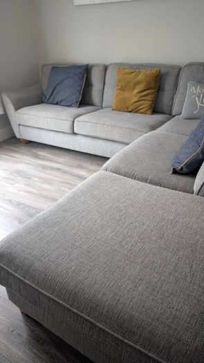 Gray fabric corner chase sofa with footstool