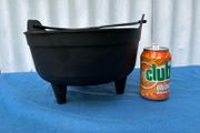 Black plastic flower pot on raiserd legs