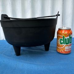 Black plastic flower pot on raiserd legs