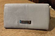 River Island clutch purse featuring a dual-texture gray flap panel design and a central dark metallic logo plate. Perfect inside.