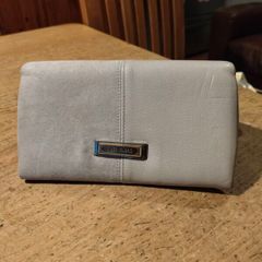 River Island clutch purse featuring a dual-texture gray flap panel design and a central dark metallic logo plate. Perfect inside.