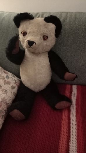 Antique straw-filled panda teddy bear