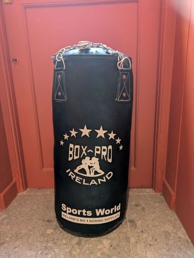 boxing Punch bag and punchbag hanger. Enthusiastically bought by my husband for our, then, 5 yo son. NEVER been punched! recently while playing with friends my son removed the cover.
