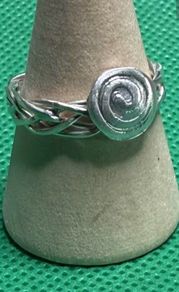 Handmade sterling silver Celtic spiral woven band ring. Size o