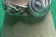Handmade sterling silver Celtic spiral woven band ring. Size o