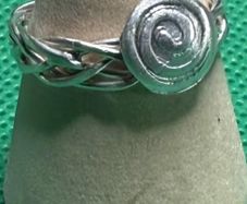 Handmade sterling silver Celtic spiral woven band ring. Size o