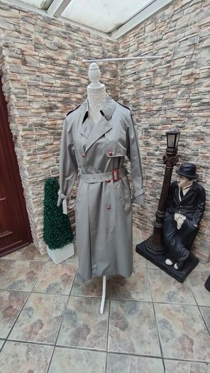 Vintage Nuage ladies trenchcoat Approximately late 90s early 00s Size 10 on label The colour is a pale bluey grey with brown buttons It's got an inner lining that can be removed