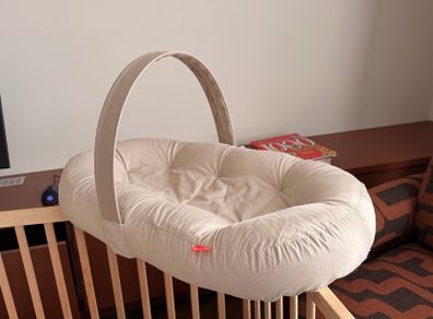 Cozy lounger with activity arch - Done By Deer