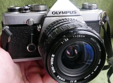 Olympus OM-1 MD 35mm SLR Film Camera & Sigma 2.8 28mm (works well)