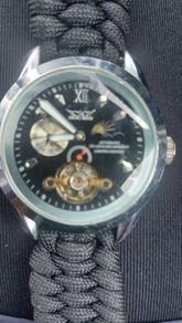 black dial  open-heart movement black paracord strap.
