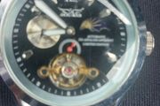 black dial  open-heart movement black paracord strap.