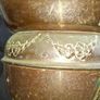 Antique Copper Jardiniere Planter, likely dating from around 1880s to 1920s. It features a distinctive scalloped, or frilled, edge rim. The body is adorned with embossed floral and swag designs. Image 6