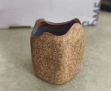 Small pottery pen holder.