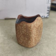 Small pottery pen holder.