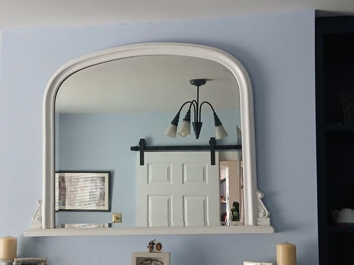 white over mantlepiece mirror