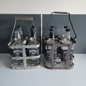 10 empty Jack Daniel bottles