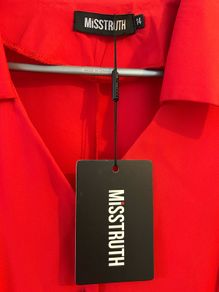 Brand new dress . Still with tag but with stained on left sleeve.