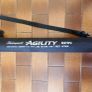 Shakespeare Agility Spin fishing rod. 11 feet (3.30 meters) in length. The item includes a black carrying tube with a strap for transport. Image 2