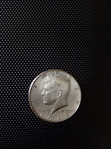 1964 kennedy half dollar(fg) & 2000 one dollar "sacagawea