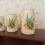 Charming vintage graduated set of three ceramic jugs Image 2