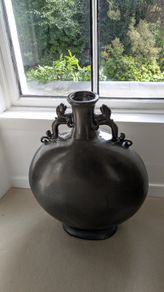 Large dark grey decorative vase with dragon handles