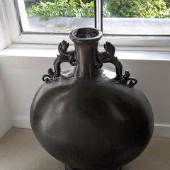 Large dark grey decorative vase with dragon handles
