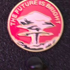 The future is bright, pin back badge.