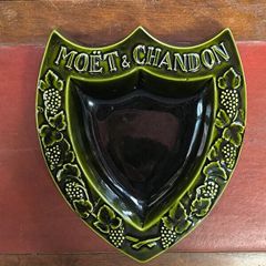 vintage Moet & Chandon shield-shaped ceramic advertising piece.