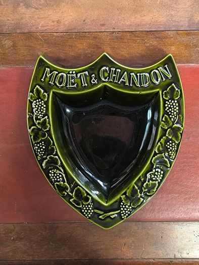 vintage Moet & Chandon shield-shaped ceramic advertising piece.