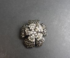 Flower-shaped Brooch with black and white crystals