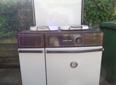 Oil tank and oil fired cooker