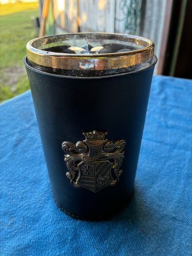 Vintage pint glass in leather holder