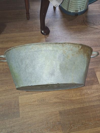 A Beautiful Large Old Galvanized Steel Wash Tub with Side Handles in nice used condition and is frequently used for Farmhouse Decor or Garden