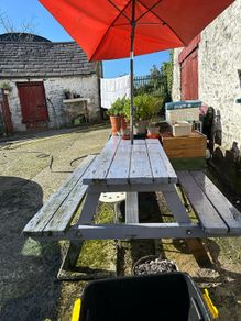 Big sized solid pub bench with umbrella