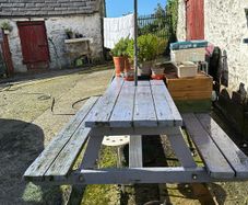 Big sized solid pub bench with umbrella