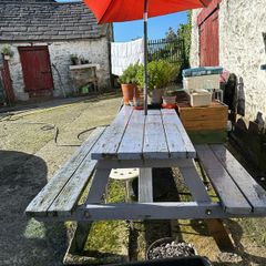 Big sized solid pub bench with umbrella