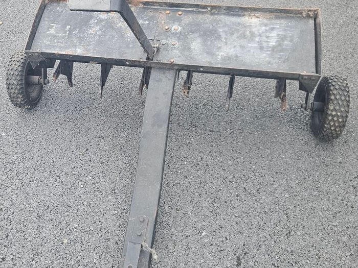Tow behind lawn aerator