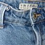 Distressed blue jeans Image 4